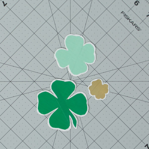 Repeat the previous step for the other clover cut-outs, then cut off all excess white background, leaving a white border