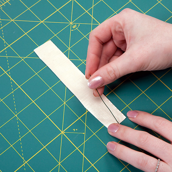 floral wire that is nearly half the length of the strip placed in the center of the strip from the previous step